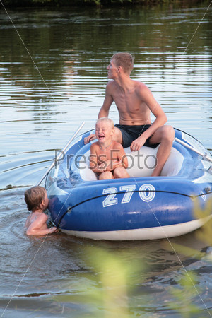 Father with son in inflatable boat