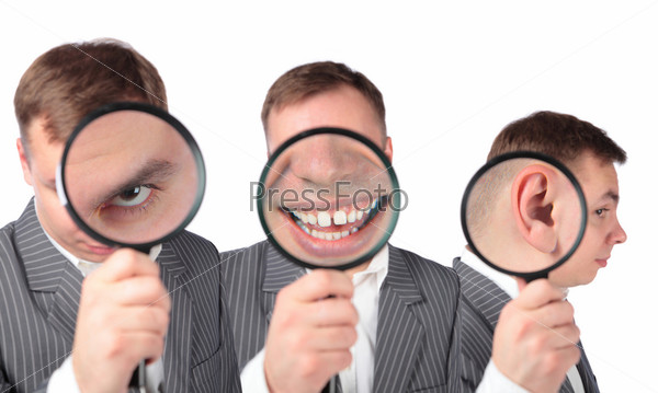 businesspeople with magnifier on ear, eye, mouth collage