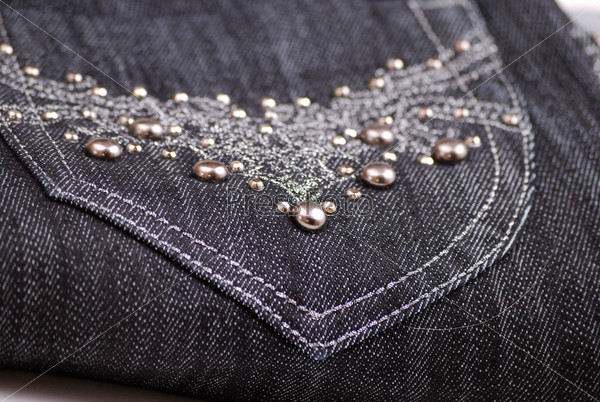 Black jeans with a beautiful embroidery on a pocket and pastes.