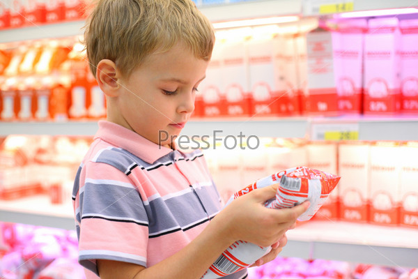 Boy in store with milk