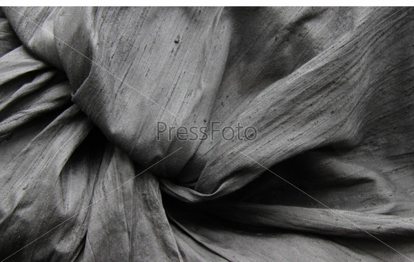 Crumpled rough black fabric (background), stock photo