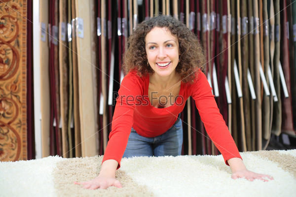 Young woman in shop with fluffy carpet