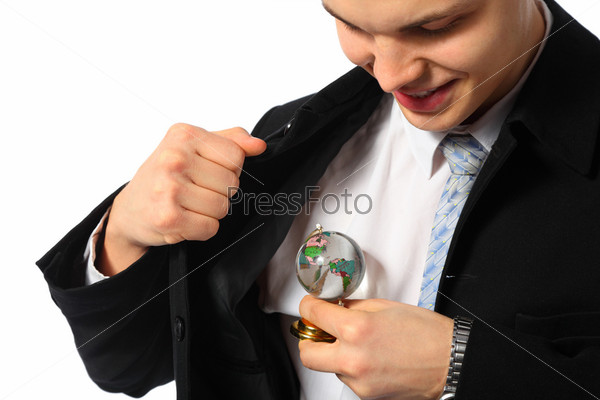 Young businessman with glass globe in hand