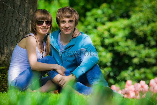 Happy young couple in park