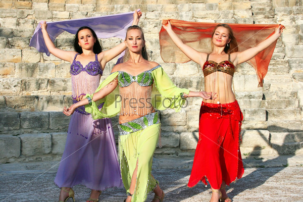 Beautiful belly dancers on the ancient stairs of Kourion amphitheatre in Cyprus.
