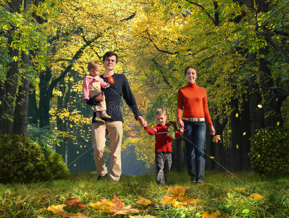 walking family with two children in autumnal park collage