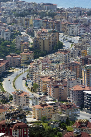 Modern and traditional apartment buildings of seaside town. Alanya, Turkey.