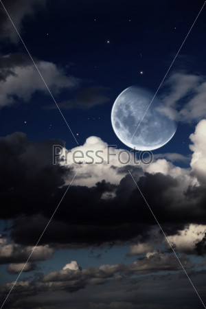 Fantastic night landscape with the big moon, clouds and stars, stock photo