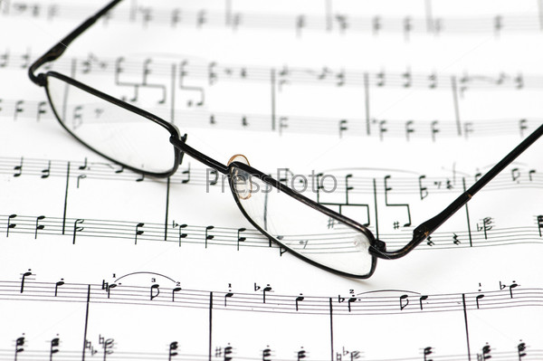 Reading glasses over the music sheets
