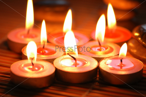 Burning scented candles for aromatherapy session, stock photo