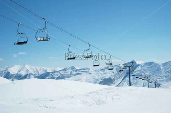 Ski lift chairs on bright day