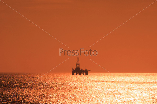Offshore oil rig during sunset  in Caspian sea - more similar photos in my portfolio