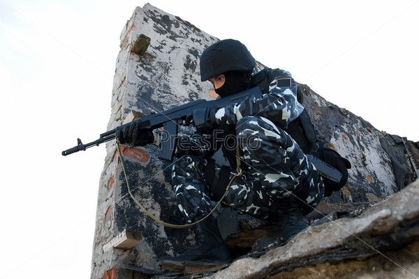 Soldier with a rifle in position