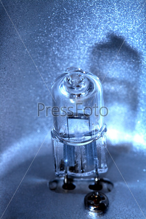 Extreme closeup of small modern halogen light bulb, stock photo