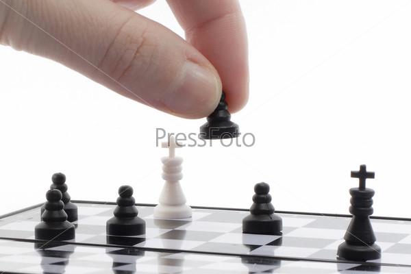 chess player plays with the pawn