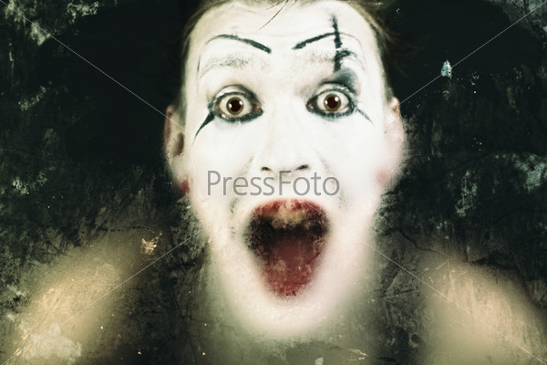 Scary face screaming mime for murky glass