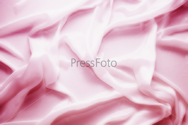 Waves of pink satin silk close up