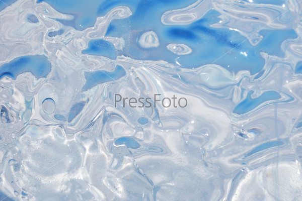Background of bizarre transparent surface of ice. Shapeless optical distortion effects
