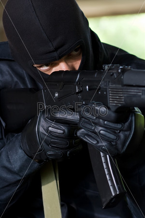 Trooper in black mask targeting with a gun