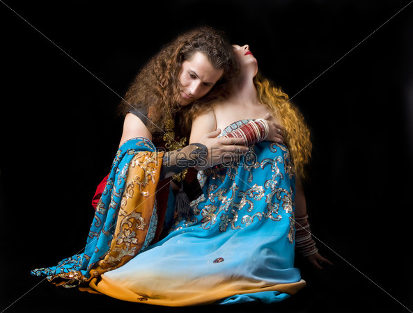 Young couple sit in indian dress