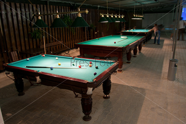 Balls and cue in the American billiards and pool