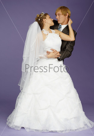 Bride and groom on purple background