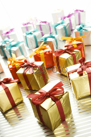 Lots of colorful gift boxes tied with ribbons. A gift for Christmas, Birthday, Wedding, or Valentine\'s day
