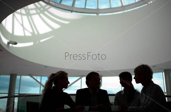 Silhouette of business people interacting with each other
