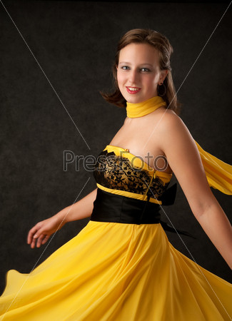 Young woman in a yellow dress
