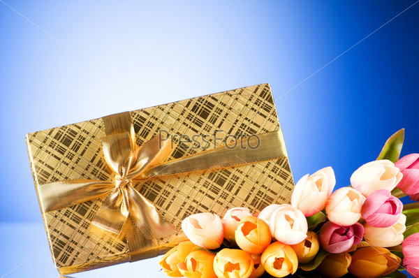 Celebration concept - gift box and tulip flowers, stock photo