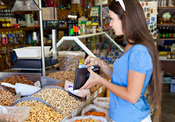 Woman is buying in food-shop