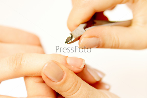 Studio nail - beautician polishing nails, stock photo
