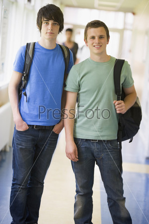 Male college students standing in university