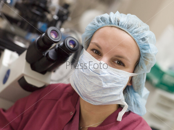 Portrait of embryologist wearing mask in laboratory