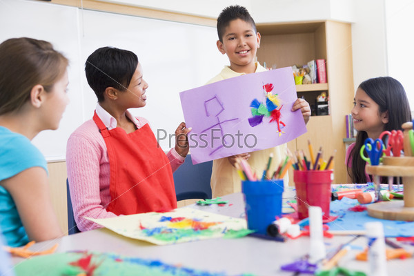 Elementary school art class with teacher