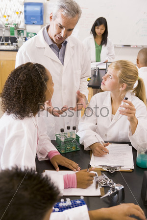Students in physics class with teacher
