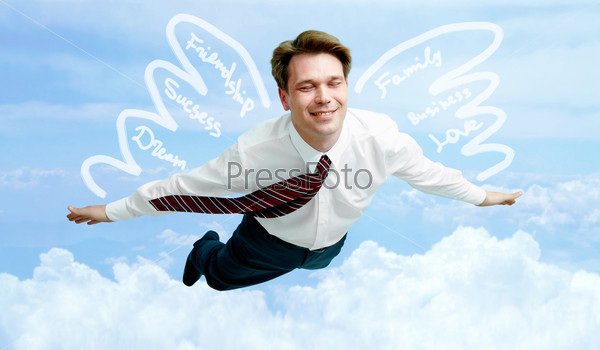 Conceptual image of smiling businessman enjoying flying in the clouds
