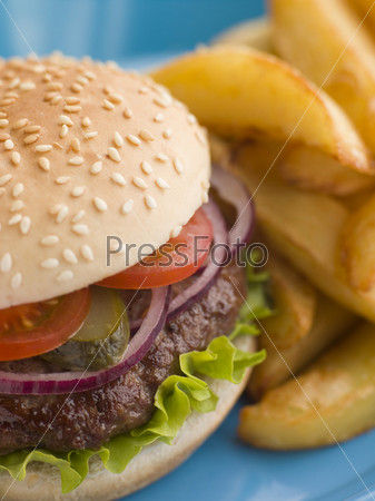 Beefburger with Salad and Pickles in a Sesame Seed Bun with Chips