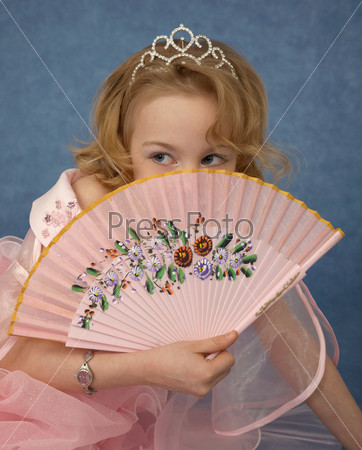 Girl hides behind her fan
