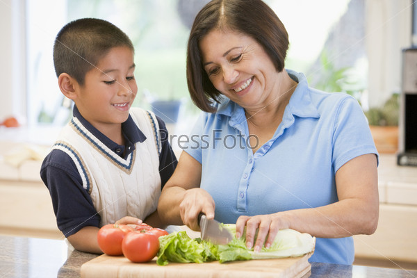 Grandmother And Grandson Preparing meal,mealtime Together