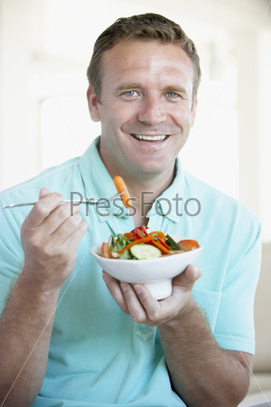 Mid Adult Man Eating A Salad