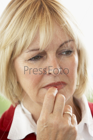 Portrait Of Middle Aged Woman Frowning