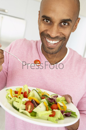 Middle Aged Man Eating A Salad