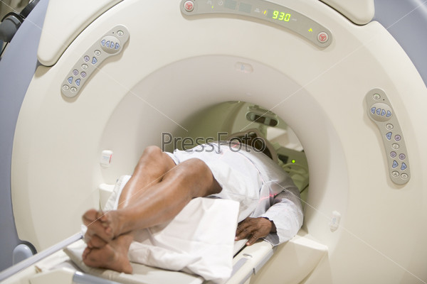 Nurse With Patient As They Prepare For A Computerized Axial Tomography (CAT) Scan, stock photo