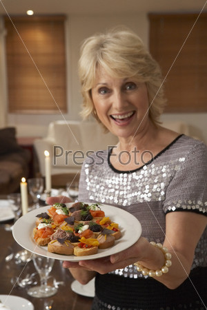 Woman With Hors D\'oeuvres For A Dinner Party