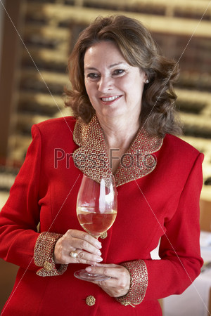 Woman Having A Glass Of Wine At A Bar