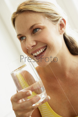Young Woman Drinking A Glass Of Water