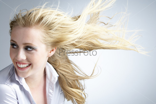 Young Woman With Hair Blowing Behind