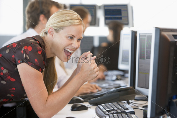 Stock Trader Overjoyed Looking At Monitor