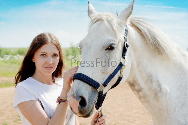 beautiful woman and white horse at rural area
